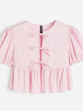 Divided Light Pink Peplum Top with Bow Detail